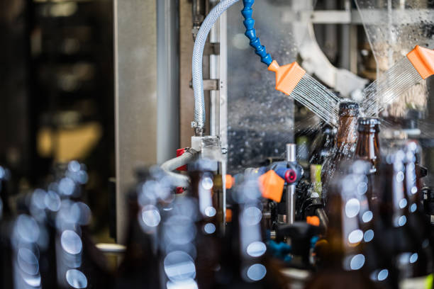 istock Bottles washing after filling 915601632