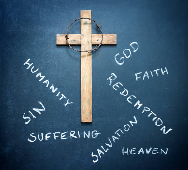 istock Easter cross and words on blackboard abstract religion concept 915601900