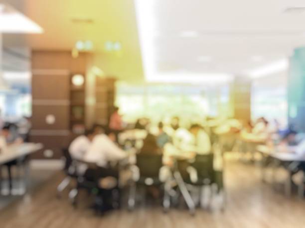 istock blurred image of university students training / reading / searching for books / and preparing for the final examination in modern library at university, blur group of people or researcher 915607590