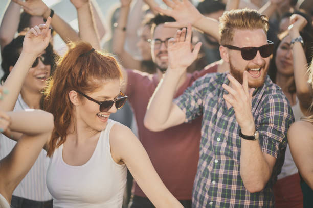 istock Big crowd of people having a party 915608320