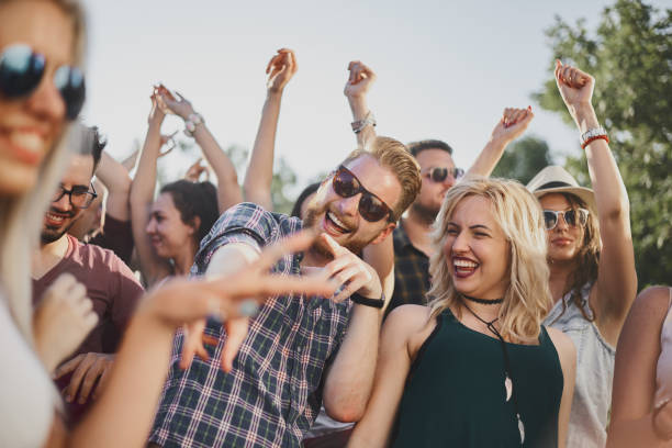 istock Big crowd of people having a party 915612616