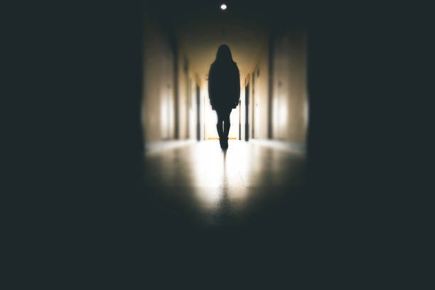 istock Young woman walking to window 915612638