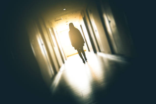istock Young woman walking to window 915612862