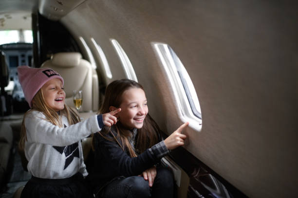 istock Sisters in the airplane 915612960