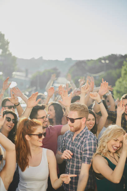 istock Big crowd of people having a party 915613196