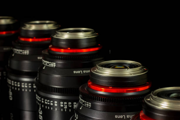 istock Professional Cinema Lens - camera lenses on the mirroring black background. 915613338