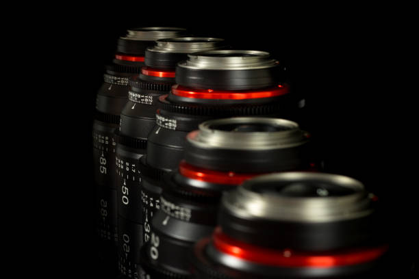 istock Professional Cinema Lens - camera lenses on the mirroring black background. 915613466