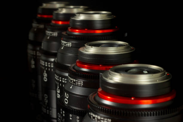 istock Professional Cinema Lens - camera lenses on the mirroring black background. 915613492