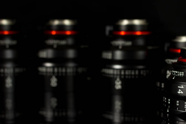 Professional Cinema Lens - camera lenses on the mirroring black background.