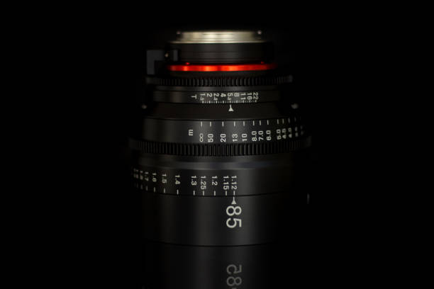 istock Professional Cinema Lens - camera lenses on the mirroring black background. 915613862