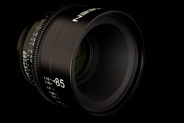 istock Professional Cinema Lens - camera lenses on the mirroring black background. 915616078