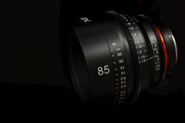 istock Professional Cinema Lens - camera lenses on the mirroring black background. 915616166