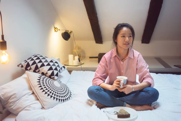 istock Young Chinese woman eating cake 915616570