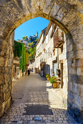 Rocamadour, France - October 05, 2017: View from historic village and castle Rocamadour on the bank of the valley Dordogne in southern France in autumn. Main street with shops, cafe and restaurants in Rocamadour.