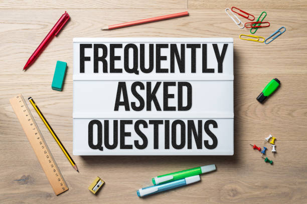 istock Frequently asked questions written on lightbox lying on floor 915621110