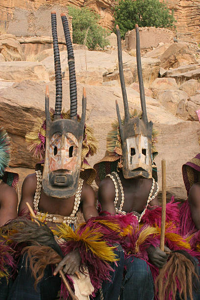dogon masken dancers - dogon tribe stock-fotos und bilder