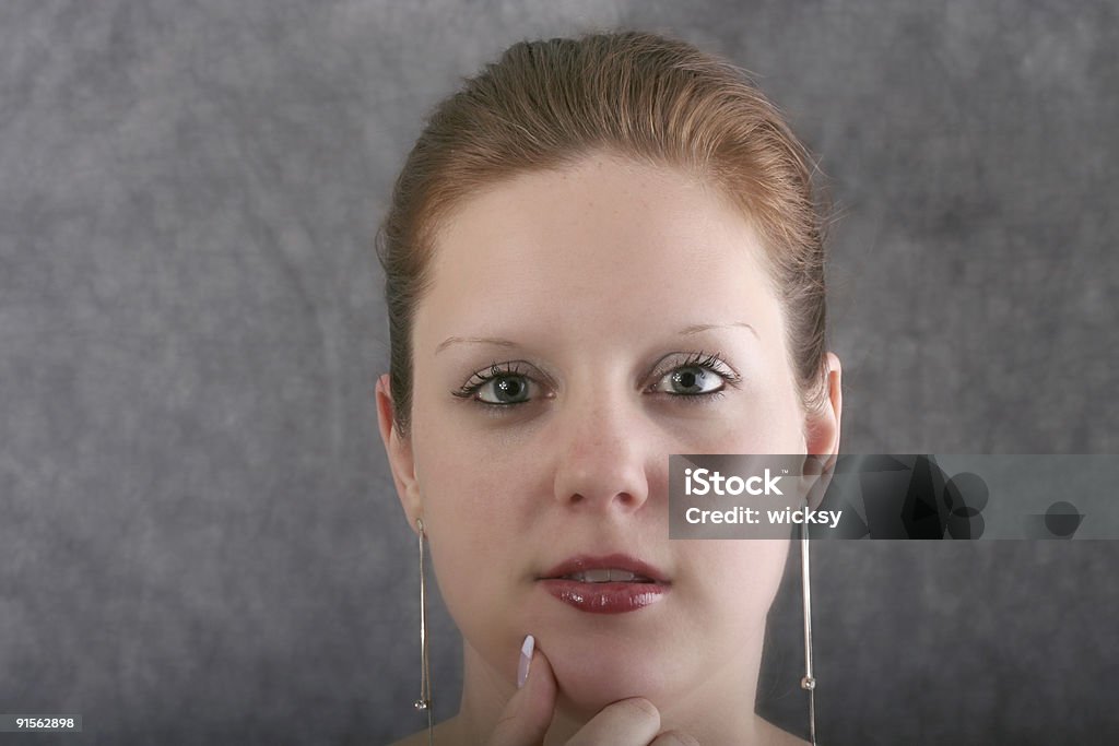 Beautiful young woman Beautiful young woman looking directly into camera. Accessibility Stock Photo