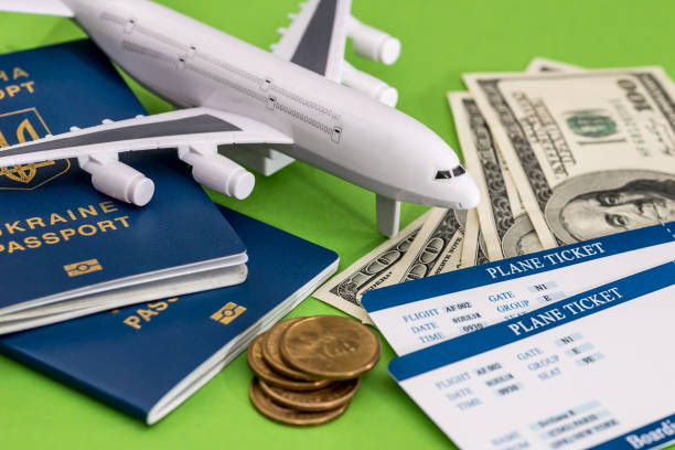 istock Airplane, passport, ticket and dollar on green 915630274