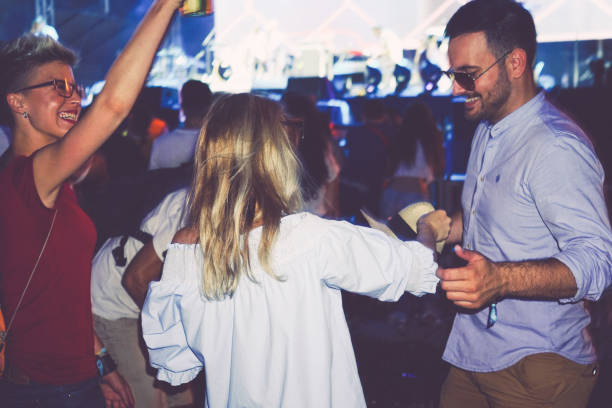 istock Attractive hipsters dancing on festival 915631386
