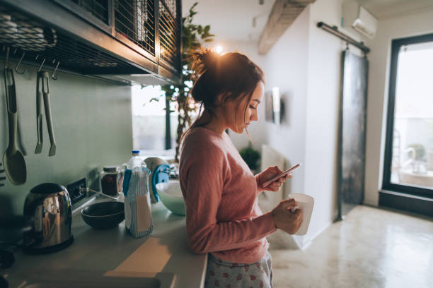Young woman drinking first morning coffee