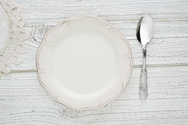 Empty plate dish with spoon food hungry concept