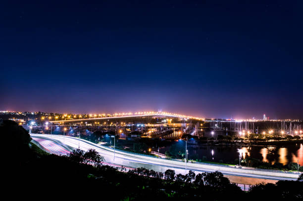 istock cars in motion on a lighted bridge and highway 915633752