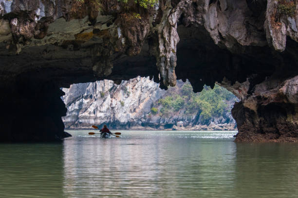 istock people kayaking in ha long cave, vietnam 915636426