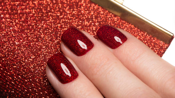istock Bright festive red manicure on female hands. Nails design 915640438