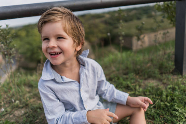 istock Happy little boy enjoying a day in nature. 915644718