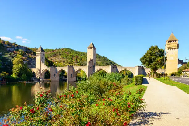 The Valentre Bridge on Lot River of Cahors. Cahors is medieval village, and capital of the Lot department in south west France. The bridge was built in the 14th century.