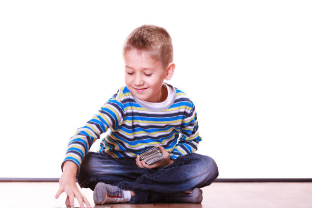 istock Little boys have fun and play cards. 915645402