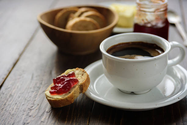 istock Breakfast with coffee, bread, butter and jam 915646160