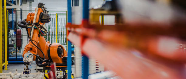 istock Industrial robotic arms performing operations 915648392