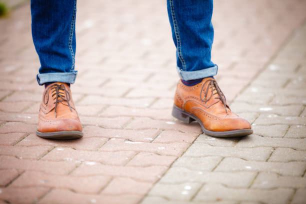 istock Male legs in jeans and boots 915651852