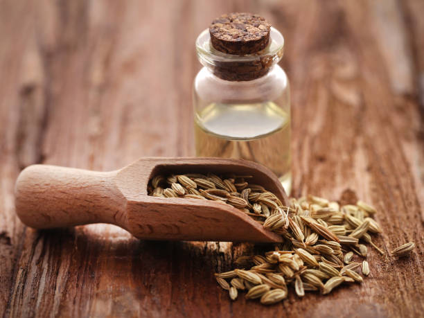 istock Fennel seeds with essential oil in a bottle 915651932