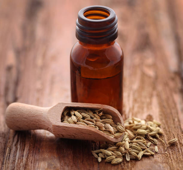 istock Fennel seeds with essential oil in a bottle 915651946
