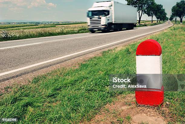 Road Milestone With Moving Truck In The Background Stock Photo - Download Image Now - Blank, Color Image, Copy Space