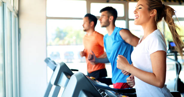 istock Young attractive woman doing cardio training in gym 915652998