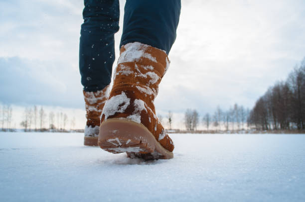 istock Man walking in military boots through the snow, 915655924