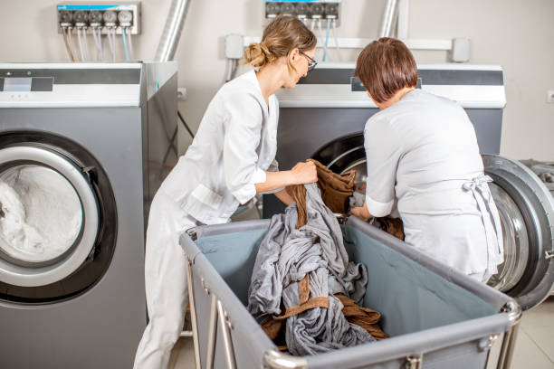 senior washwoman in the laundry - service cloth imagens e fotografias de stock