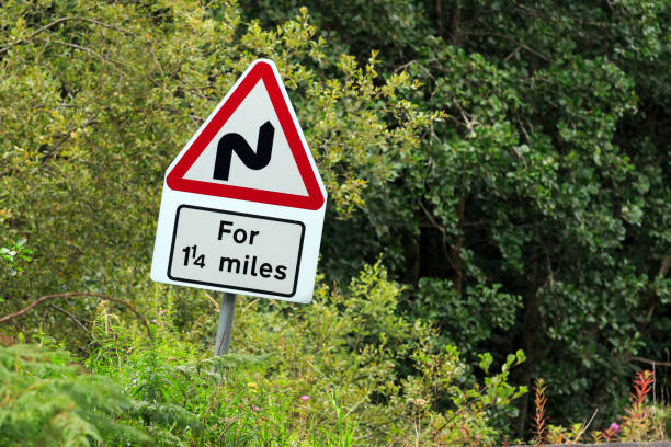 istock Bends for one and a quarter miles road sign 915656814