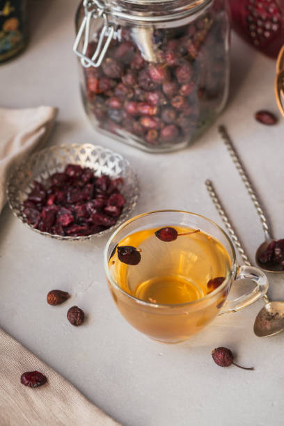 istock Hot herbal tea with a dogrose in a glass cup. 915657794