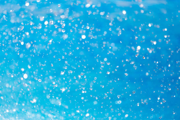 istock Splashes of blue water in the pool 915660974