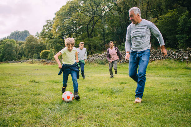 istock Playing Football With Grandad 915665178