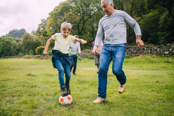 istock Playing Football With Grandad 915665180