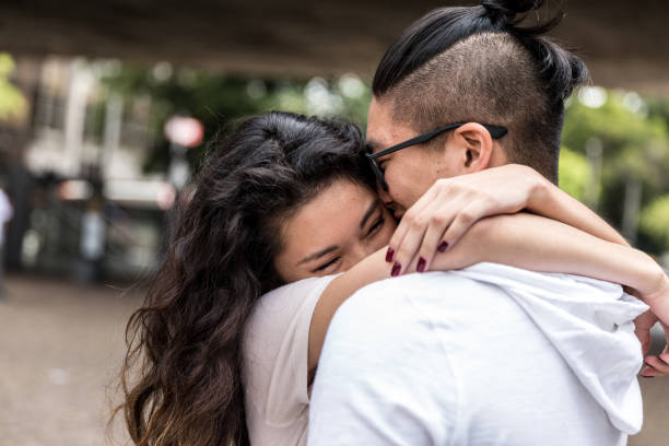 Romantic Asian Couple Meeting/Hugging