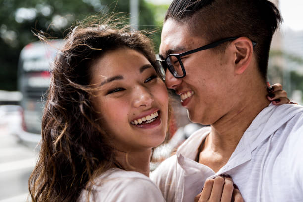 istock Young Asian Couple Taking Selfie 915666592