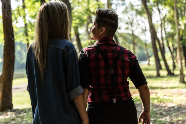 istock Lesbian couple in love walking 915669126