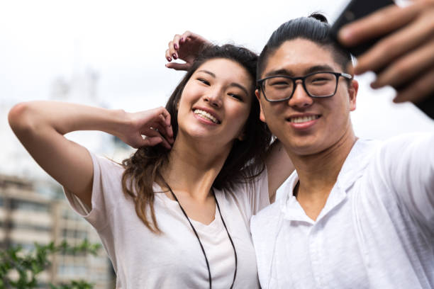 istock Asian Couple Taking a Selfie 915669284