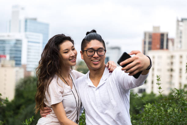 istock Asian Couple Taking a Selfie 915669290